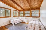 Beautiful upstairs bedroom with twin beds and tons of natural light